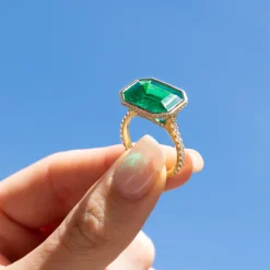 Shop BEZELED EMERALD CUT EMERALD RING WITH DIAMOND BASKET AND BAND One Of A Kind